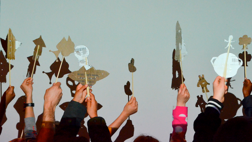 Kids at the Cape Town Science Centre project their space-themed cardboard creations on a screen in the puppet theater. (Photo c/o Steve Sherman)