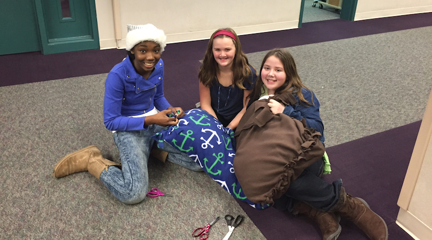 Three students make dog beds to bring to the Indy Humane Society. (Photo c/o Steve Auslander)